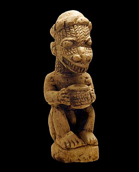 Small statue of a reptilian creature, found in the Nomoli collection